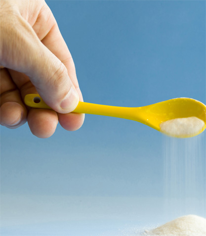 Sugar poured from spoon